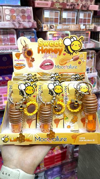 Lip gloss mel com chaveiro mocoallure